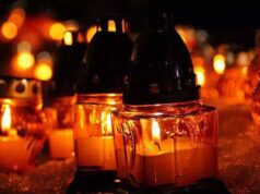 У Нововолинську після панахиди позбирали поминальні лампадки та прапори У Нововолинську після панахиди позбирали поминальні лампадки та прапори